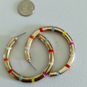 Rainbow and gold metal eating hoops